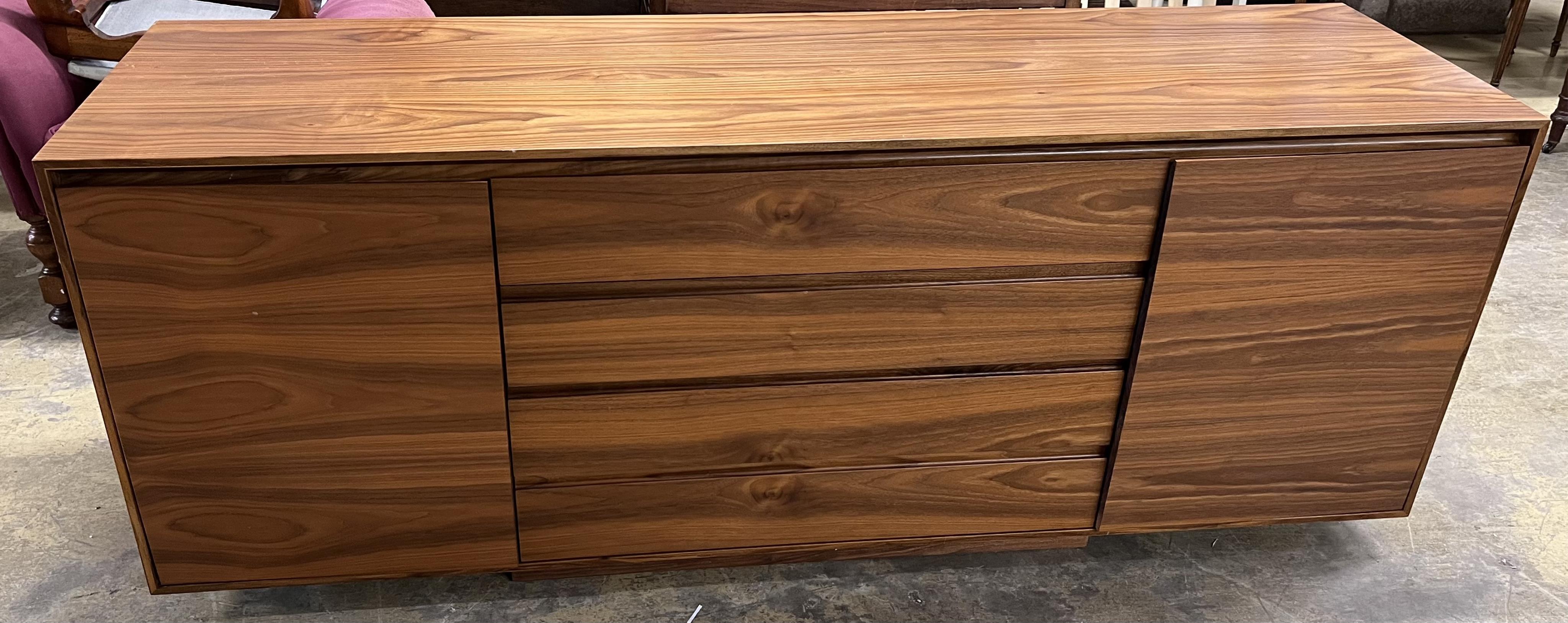 A Contemporary American black walnut sideboard, by Chartwood design Ltd., width 200cm, depth 55cm, height 77cm. Condition - fair to good